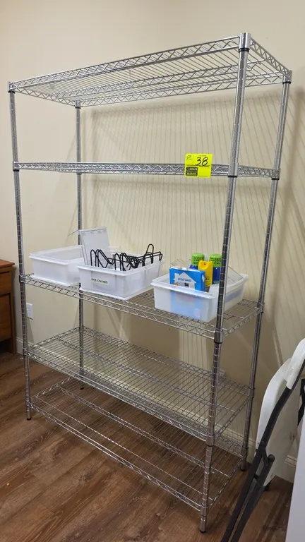 5-tier chrome wire shelving rack. Features 5 adjustable shelves and leveling feet. Includes plastic tubs with assorted contents including call bells,
