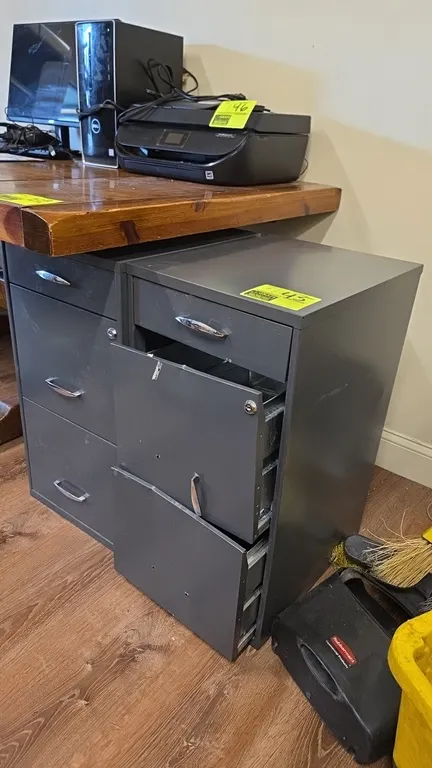 Metal vertical 3-drawer file cabinets. Features gray metal construction, upper box drawer, two lower file drawers, and chrome-tone handles. 27"H. Note