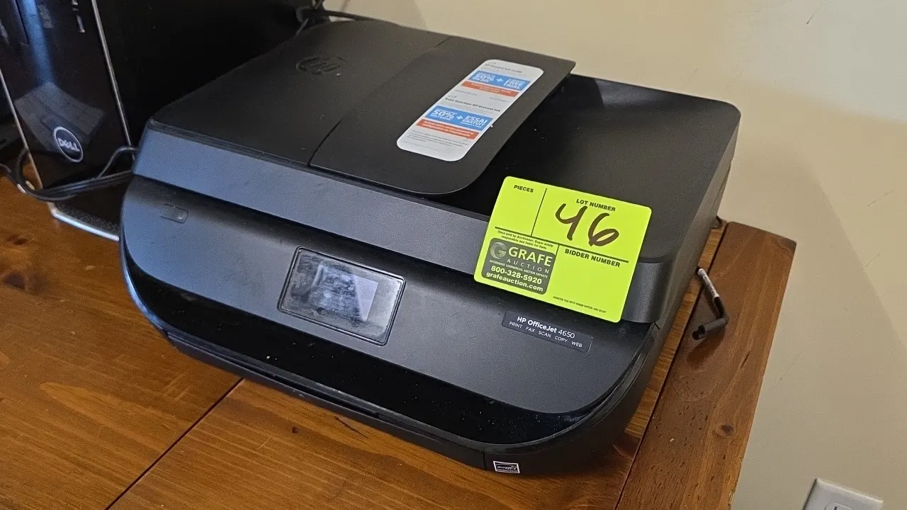 HP OfficeJet 4650 all-in-one printer. Features print, fax, scan, copy, and web functions, integrated document feeder, and digital display screen. S/N: