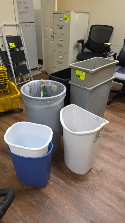 Plastic trash cans and wastebaskets. Features assorted styles including tall slim receptacles, a tall round container, a half-round can, smaller waste