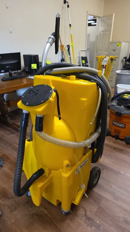 Kaivac No-Touch cleaning machine. Features chemical metering system, vacuum wand with squeegee attachment, and assorted hoses. S/N: 2158. Electrical: