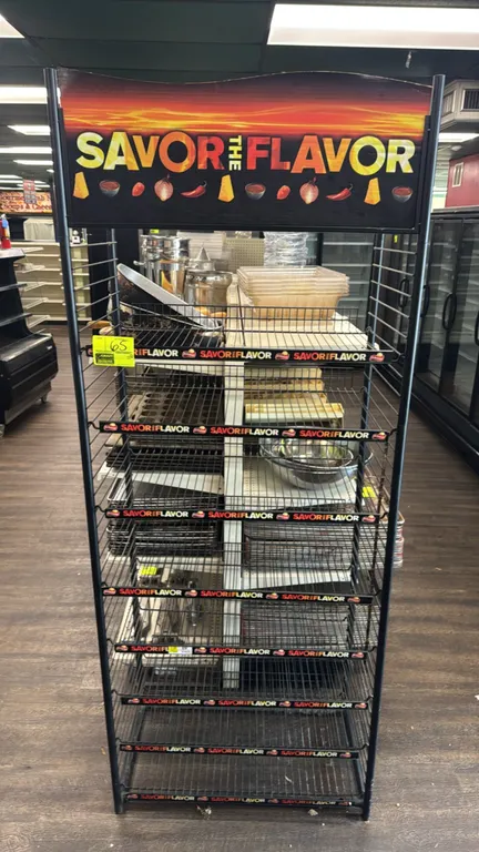 Metal coated 8-tier snack merchandiser display rack. Features black wire construction, 8 wire shelves with 'Savor the Flavor' channel strip labeling,
