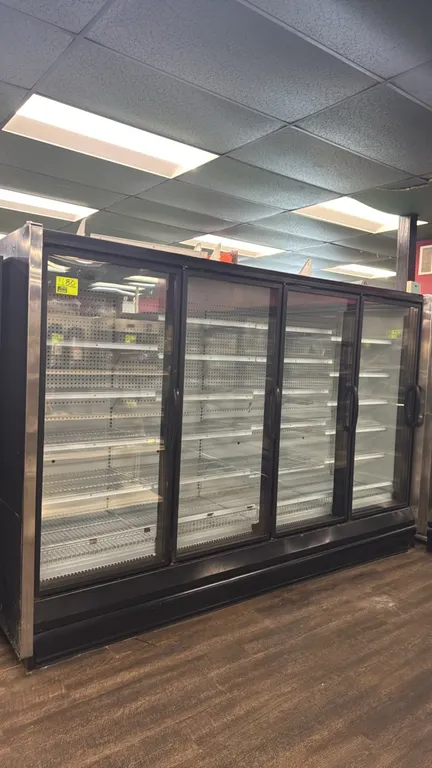 2004 Hussmann RL-4 frozen food glass doors. Features electric defrost, LED interior lighting, and adjustable wire shelving. Electrical: 120V / 208V. N