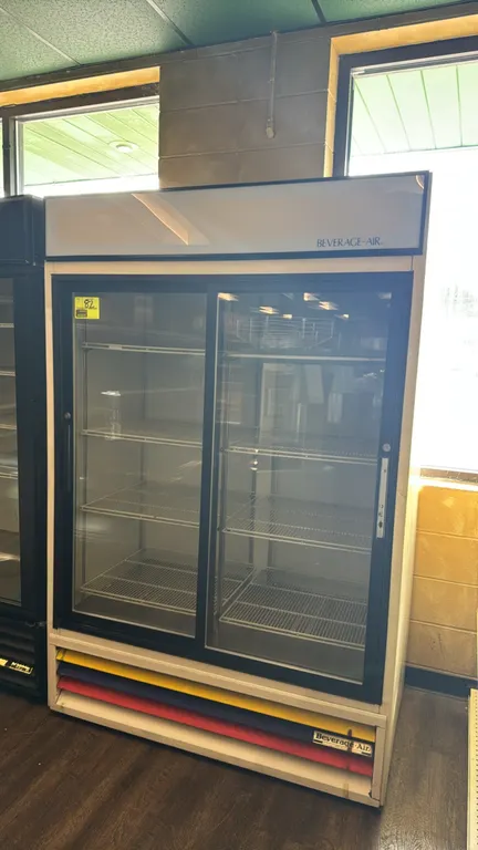 Beverage-Air MT45 2-door sliding glass merchandiser refrigerator. Features self-contained refrigeration, lighted top sign panel, adjustable wire shelv