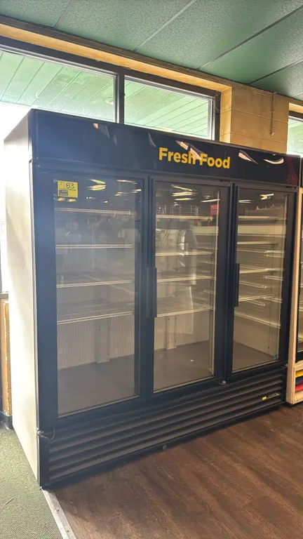 True GDM-72 3-door glass door merchandiser refrigerator. Features self-contained refrigeration, "Fresh Food" illuminated upper sign panel, adjustable