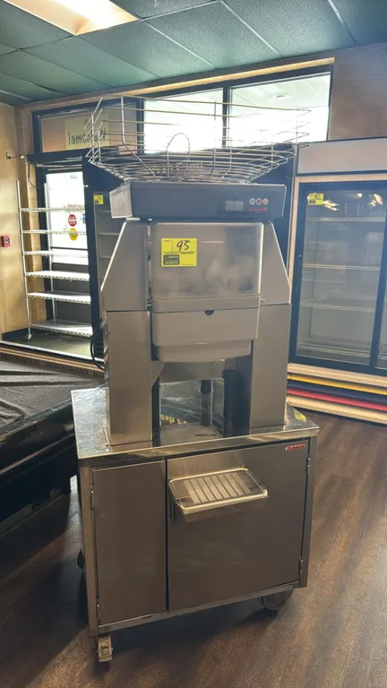 Zummo Z40C2.0 commercial citrus juicer. Features stainless steel construction, top wire fruit feed hopper, digital control panel, front drip tray, and