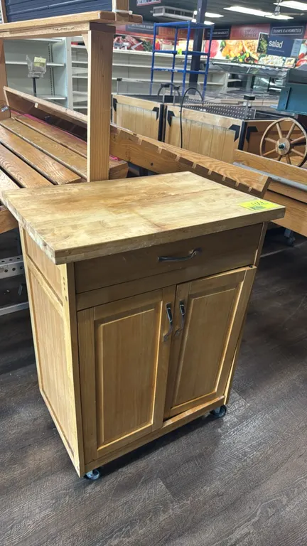 Portable wood sampling stand. Features a butcher block top, (1) upper drawer, and a lower 2-door storage cabinet. 28"L x 19"W x 36"H. Mounted on caste