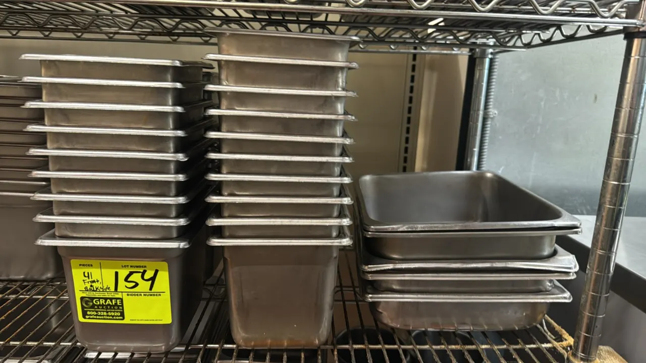 Stainless steel food pan inserts. Features an assortment of 1/6-size and 1/2-size insert pans. Depths range from 2" to 6". Shelving not included.