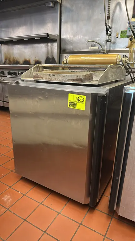 Silver King SKR27A stainless steel self-contained undercounter refrigerator. Features a single solid door and interior wire shelf. S/N: SBCH138636A. E