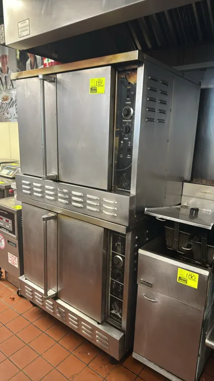 American Range Majestic double-stack gas convection ovens. Features stainless steel construction, solid doors, manual temperature and timer controls,