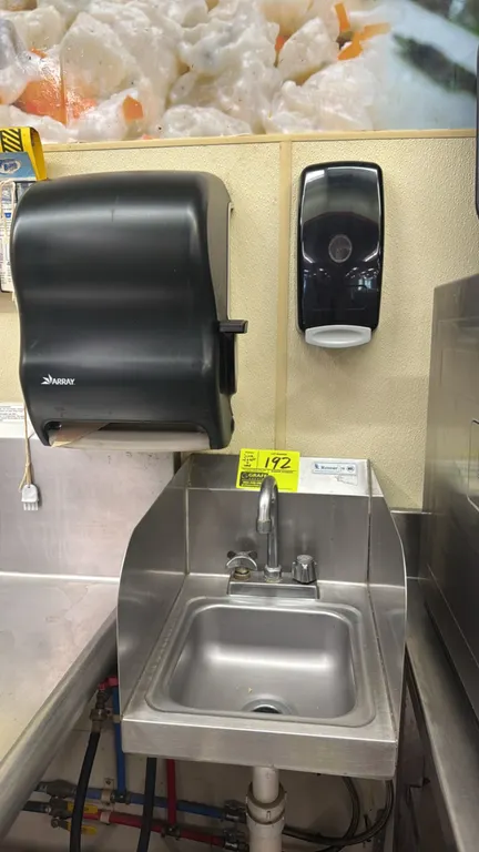 BK Resources stainless steel hand sink. Features left and right splash guards, splash-mount gooseneck faucet, and drain. Includes Array paper towel di