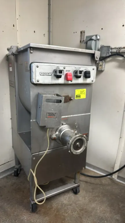 Hobart 4246 mixer/grinder. Stainless steel construction with mixing arm, feed screw, and perforated safety lid. Features front push-button controls an