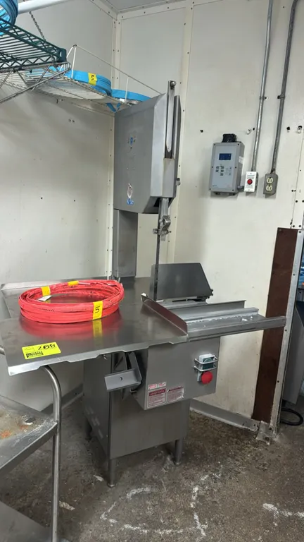 Biro 1433 stainless steel meat saw. Features sliding table carriage, adjustable cut thickness gauge, and push-button controls with emergency stop. Inc