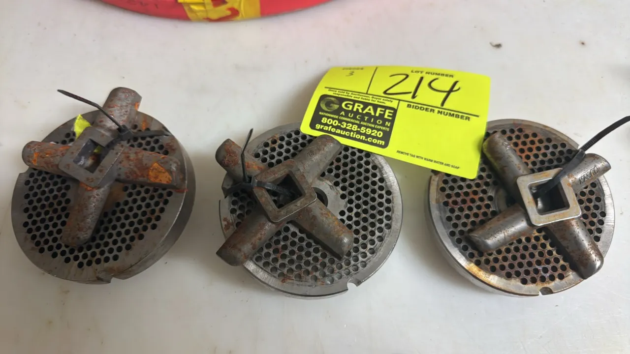 Kasco mixer/grinder plates with star blades. Features perforated plates with 4-wing cutting knives. 4" Dia. Note: Items exhibit surface rust.