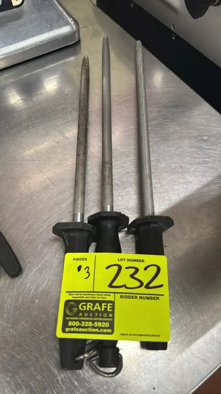 Knife sharpening steels. Features textured steel rods and molded black handles with integrated protective hand guards and hanging loop.