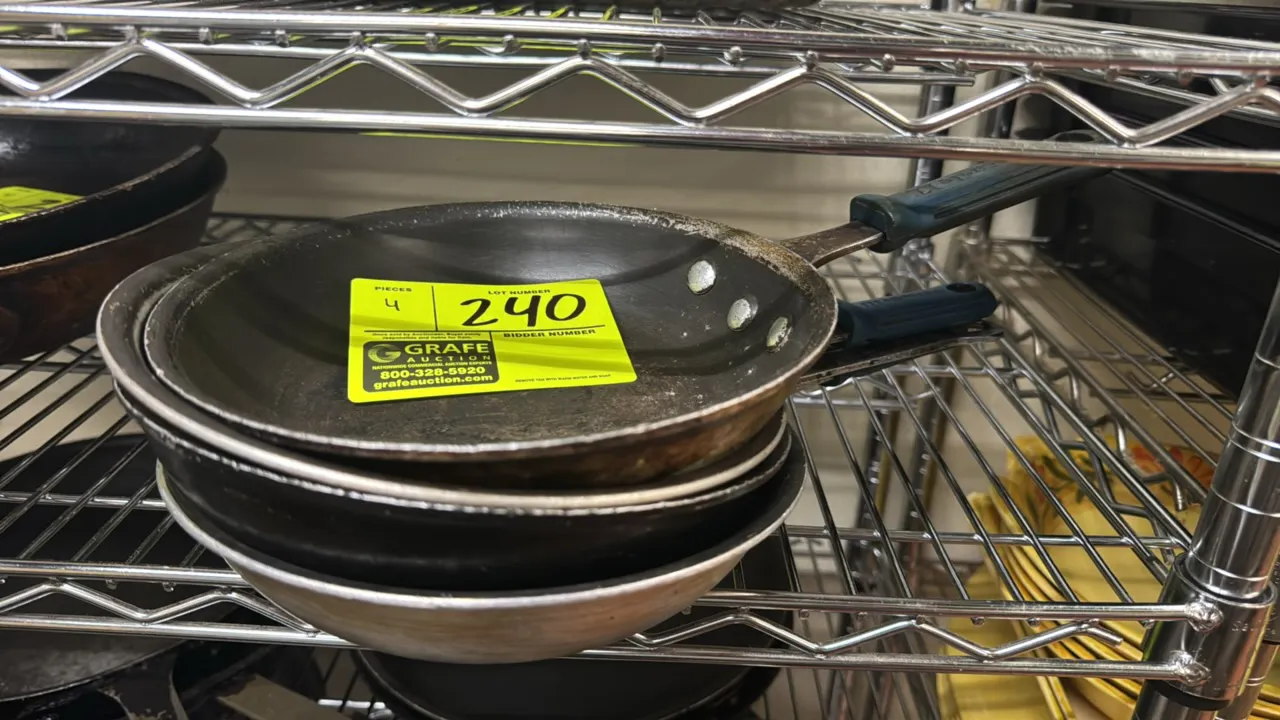Aluminum frying pans. Features riveted handles with insulated handle sleeves and non-stick interior surfaces. Dimensions: 8 1/2" Dia.