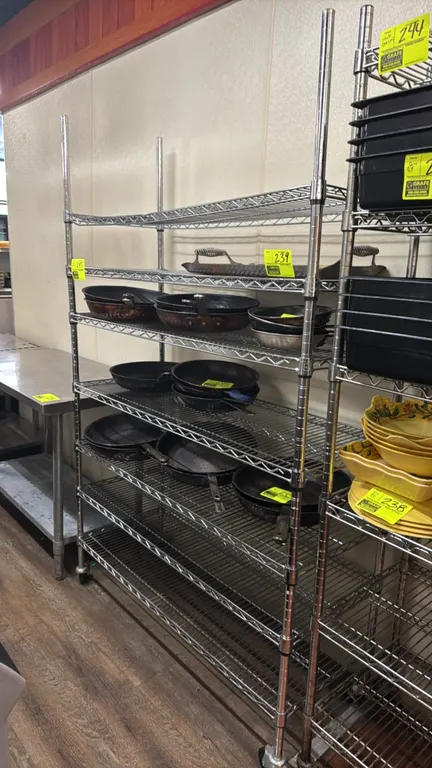 Portable 7-tier metal wire shelving rack. Features 7 adjustable wire shelves. 48"L x 18"W x 76"H. Mounted on swivel casters. Contents not included.