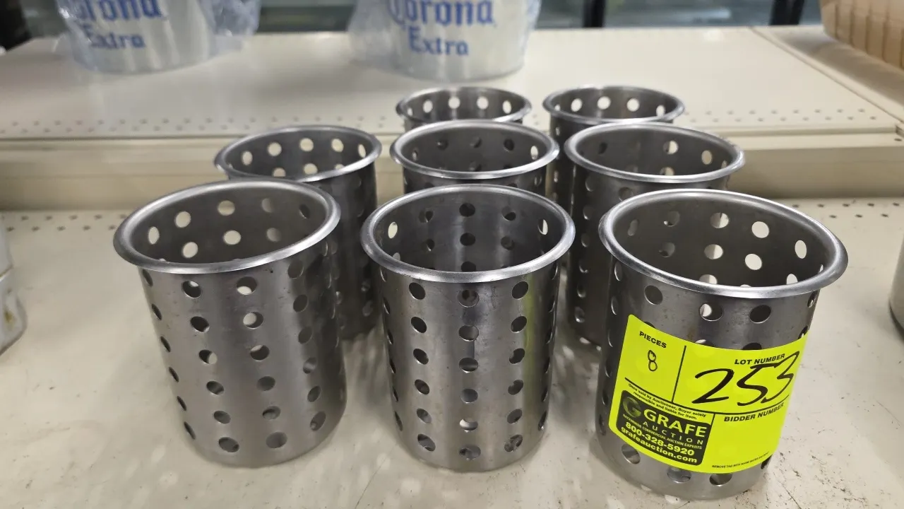 Stainless steel perforated utensil holders. Features cylindrical construction with circular perforations and rolled top rims.