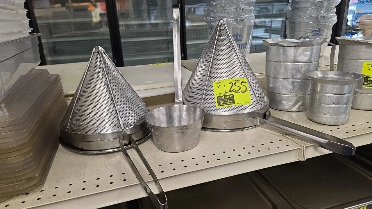 Stainless steel cone strainers with ladle. Features perforated stainless steel construction, assist hooks, and extended handles. Includes (1) 9" strai