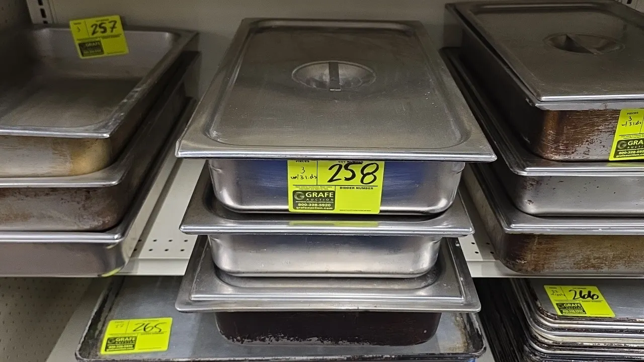 Full-size stainless steel food insert pans. Features stainless steel construction with matching solid lids equipped with recessed handles.