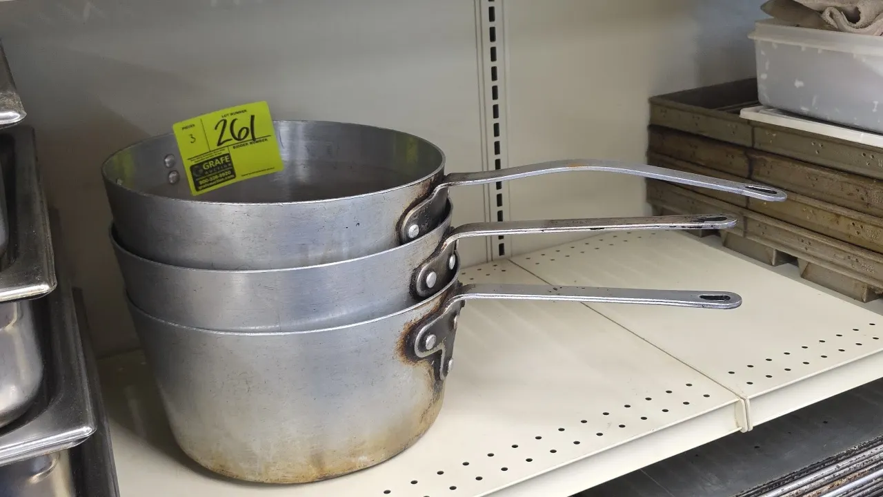 Aluminum pots. Features riveted metal handles with hanging holes. 12"Dia.
