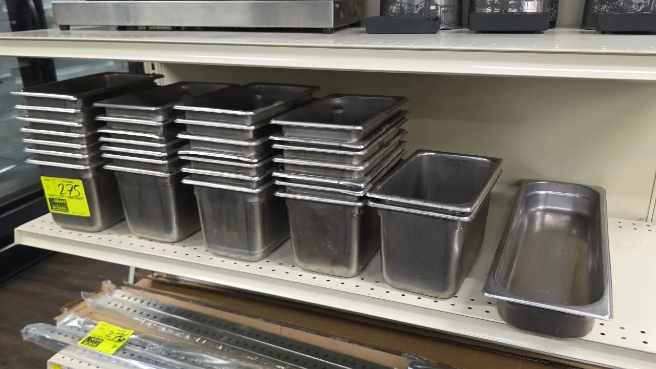 Stainless steel food insert pans. Includes (30) 1/4-size pans with 6" depth and (1) half-size long pan with 2" depth.
