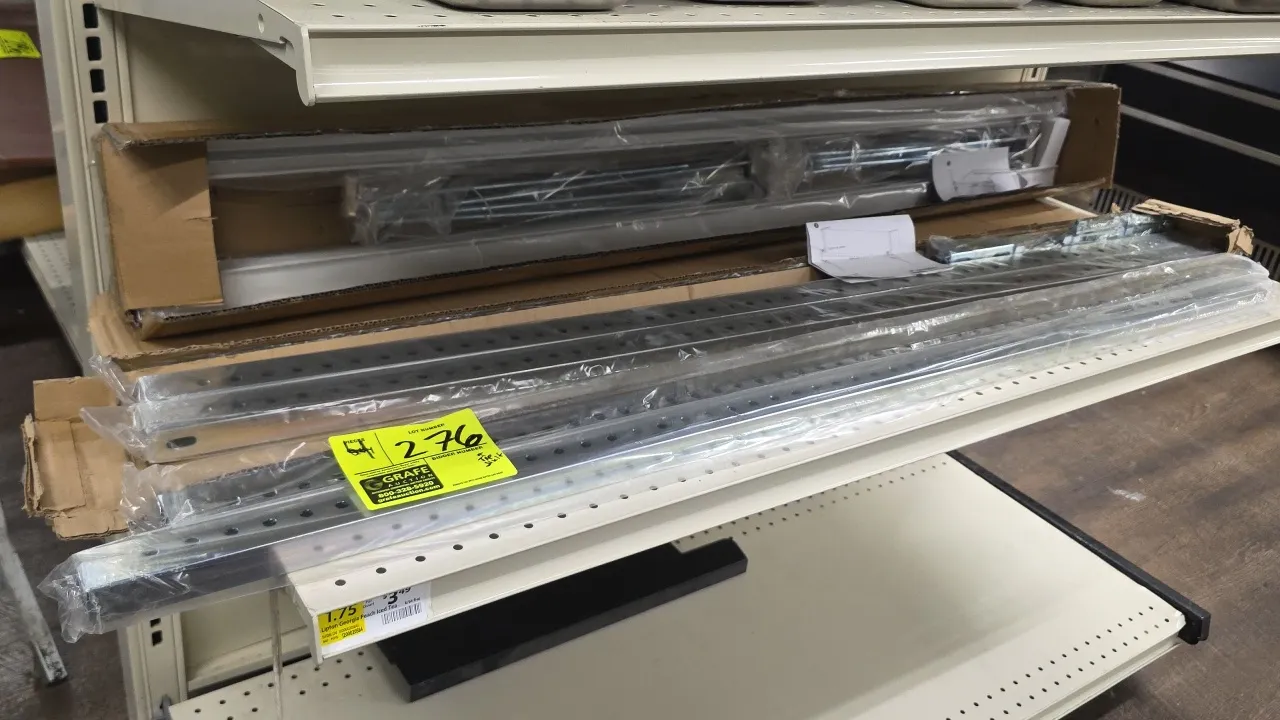 Retail Space Solutions Magna-Bar peg merchandising shelf attachments. Stainless steel construction. Includes mounting brackets, hardware, and (4) poly