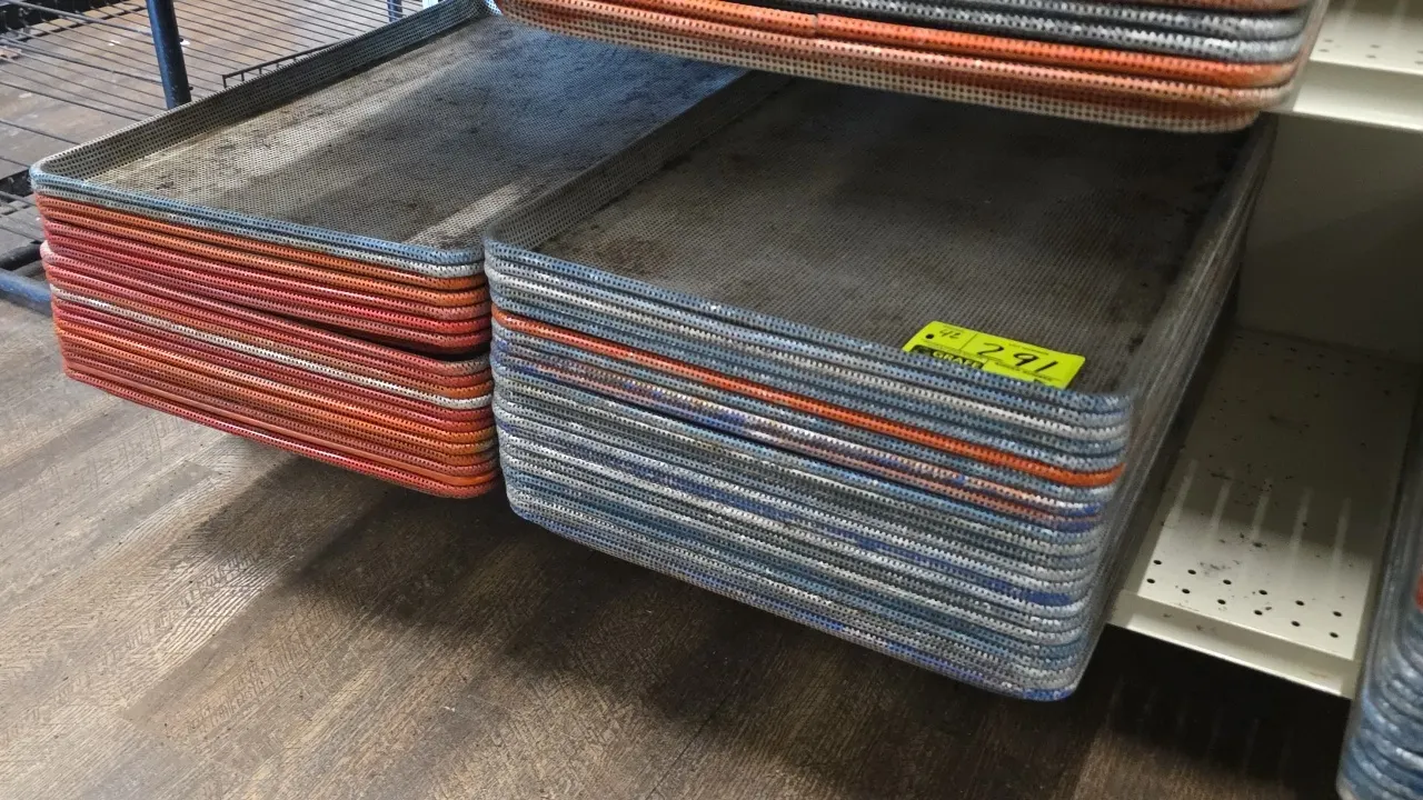 Full-size perforated aluminum sheet pan liners. Features perforated aluminum surface with wire-reinforced rolled rims in assorted colors and finishes.