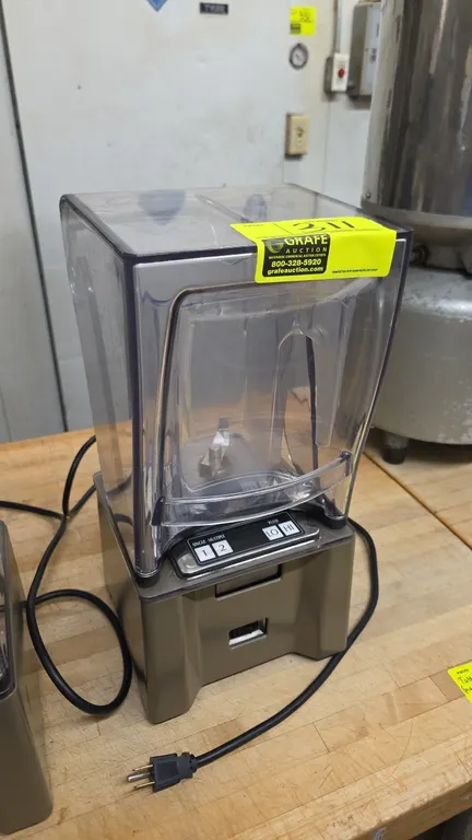 K-Tec ICB3 Smoother commercial smoothie blender. Features clear sound enclosure, blending jar with blade, and push-button controls with single, multip
