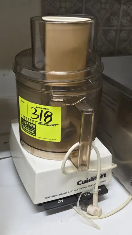 Cuisinart DLC-7 food processor. Features front paddle controls with On and Pulse/Off settings. Includes clear plastic work bowl, lid with feed chute,