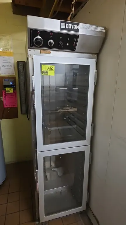 2005 Doyon E2330PM proofer. Features stainless steel construction, double glass doors, interior pan slides, and analog temperature and humidity contro