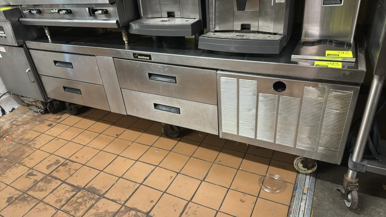 Delfield 4-drawer refrigerated equipment stand. Features stainless steel construction, 4 refrigerated drawers, and a self-contained refrigeration syst