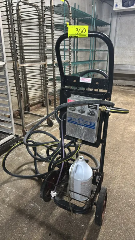 DEMA Select-O-Spray portable spray station. Features 3-way selector controls for foaming degreaser, rinse, and sanitizer, integrated chemical jug hold