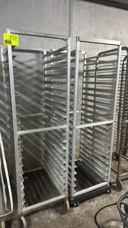 Full-size aluminum speed racks. Features multi-tier pan slide runners designed for sheet pans. Mounted on casters.