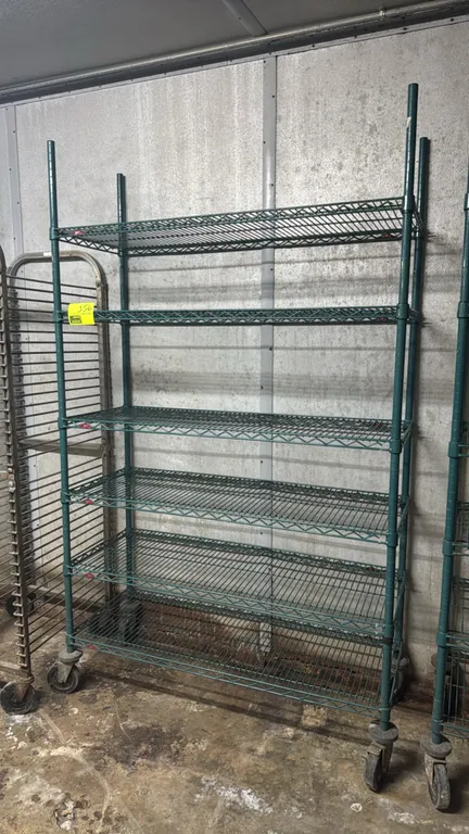 Metro 6-tier green epoxy-coated wire shelving rack. Features antimicrobial protective finish and adjustable wire shelves. Dimensions: 48" x 18" x 80".
