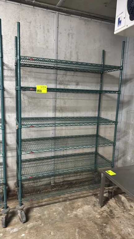 Metro 6-tier mobile wire shelving rack. Features green antimicrobial epoxy coating and six adjustable wire shelves. 48"W x 18"D x 80"H. Mounted on swi