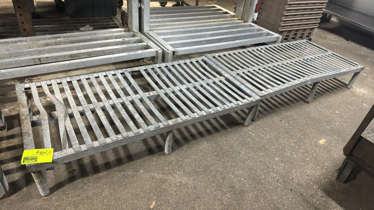 Galvanized dunnage racks. Features slotted top construction with six tubular support legs. 48" x 24". Note: Structural bending to slats and frame.