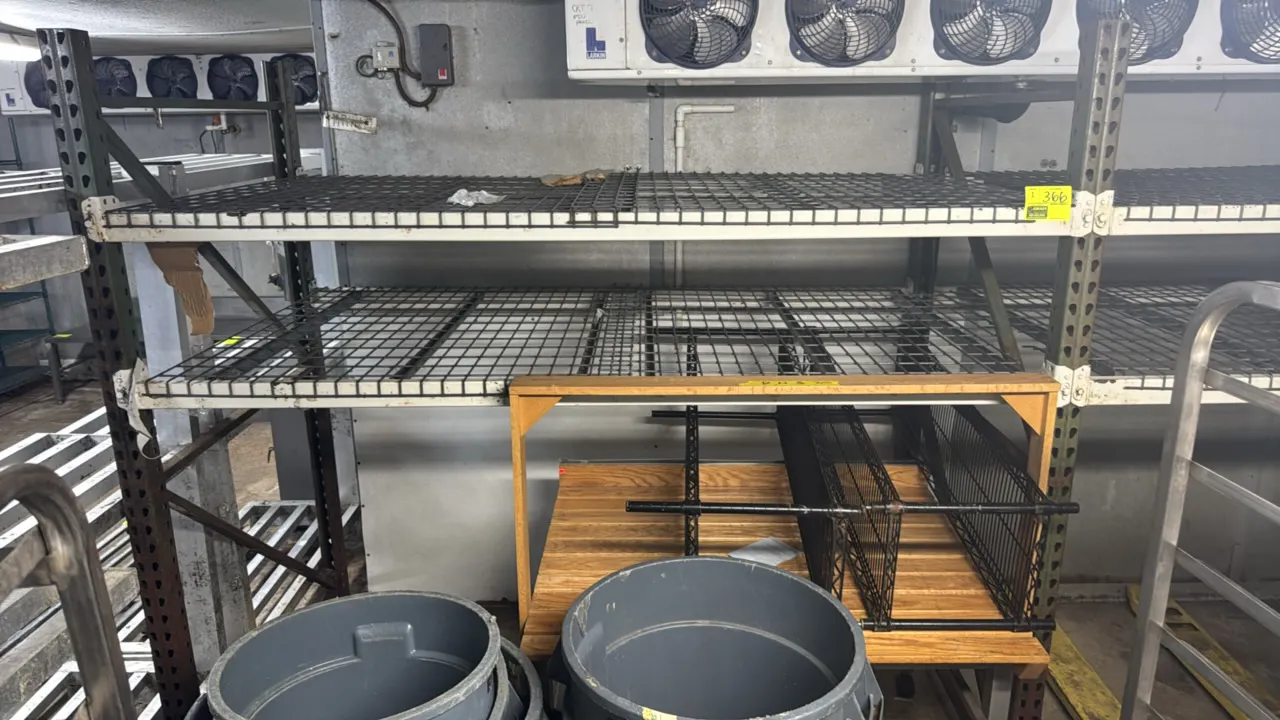 Metal 2-tier teardrop pallet racking. Features 3" crossbars and wire metal decks. 88" x 48" x 90". Contents and pallet jack not included.