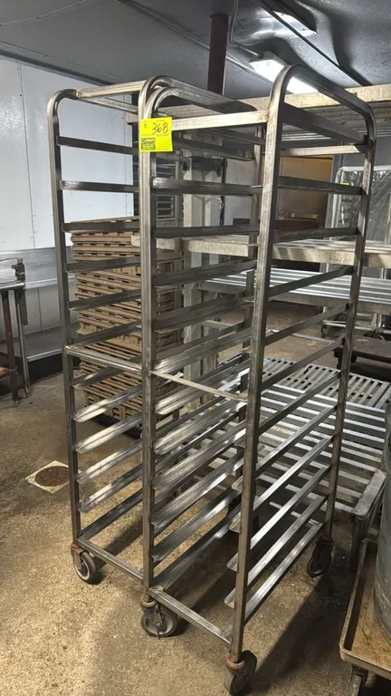 Full-size stainless steel platter racks. Features welded stainless steel construction and angle slides for platters or trays. Mounted on swivel caster