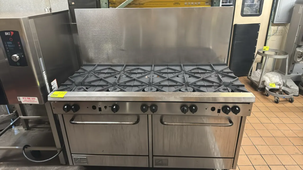 Southbend 60" 10-burner gas range. Features stainless steel construction, 10 open burners with cast-iron grates, stainless steel backsplash, and (2) s