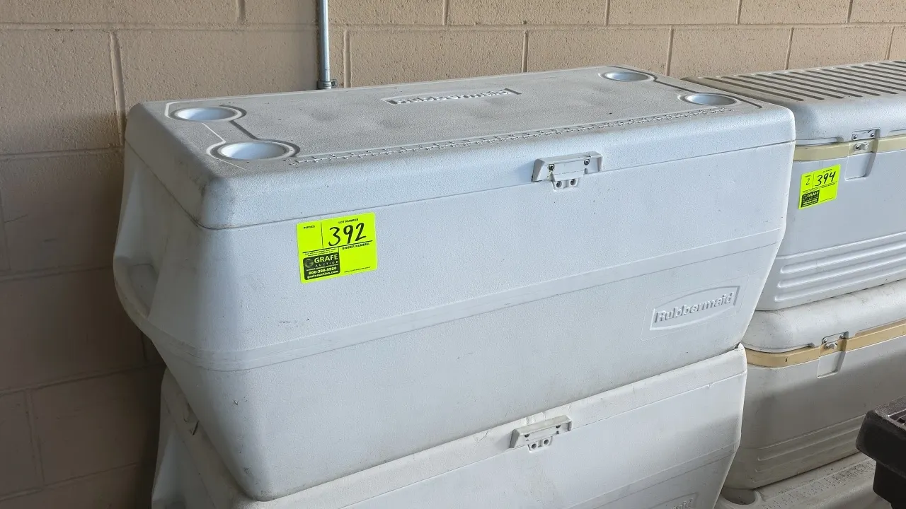 Rubbermaid insulated chest cooler. Features hinged lid with (4) molded cup holders and measuring ruler, front latch, molded side handles, and interior