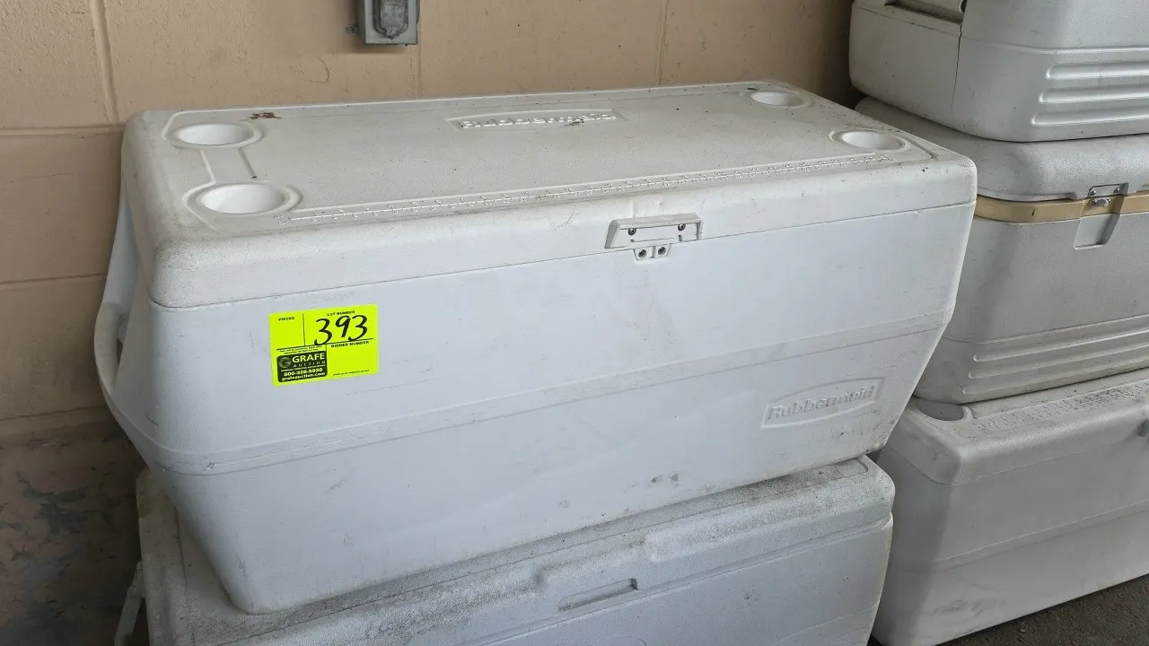 Rubbermaid insulated cooler. Features hinged lid with four molded cup holders, integrated lid ruler, front latch, molded side handles, and interior dr
