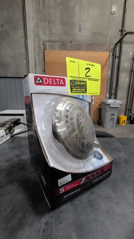 Delta 75554CS showerhead. Features a brushed nickel finish, 5 spray settings, and a maximum flow rate of 1.75 GPM at 80 PSI. WaterSense certified. In