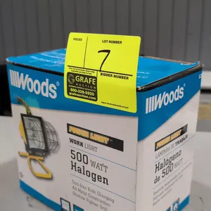 Woods Power Light portable work light. Features 500-watt halogen bulb, metal construction, wire safety grill guard, and top carry handle. Mounted on a