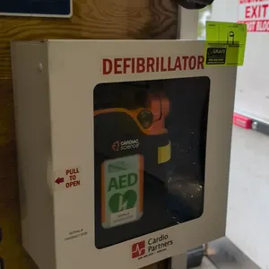 Cardiac Science automated external defibrillator (AED). Includes wall-mount metal storage cabinet with viewing window, fitted carrying case with shoul