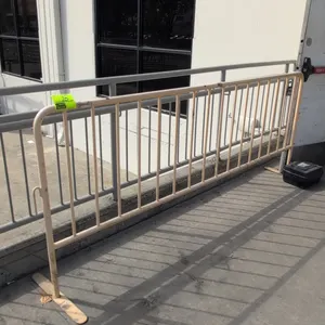 Metal crowd control barrier. Features tubular steel construction, vertical pickets, and interlocking side hooks. Dimensions: 96"W x 40"H. Supported by