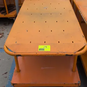 Metal 2-tier platform carts. Features orange finish, upper shelf, and lower platform deck. Mounted on 6 casters. Dimensions: 60"L x 30"W.
