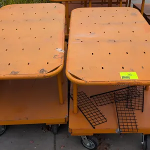 Metal 2-tier platform carts. Features orange finish, slotted upper deck, and lower platform shelf. 60" x 30". Mounted on casters. Contents not include