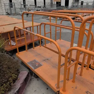 Metal platform lumber cart. Features tubular steel upright dividers and orange finish. 54" x 30". Mounted on casters.