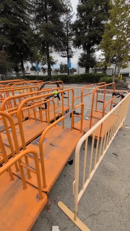 Metal platform lumber carts. Features orange tubular steel upright divider rails and heavy-duty platform deck. 54" x 30". Mounted on casters.